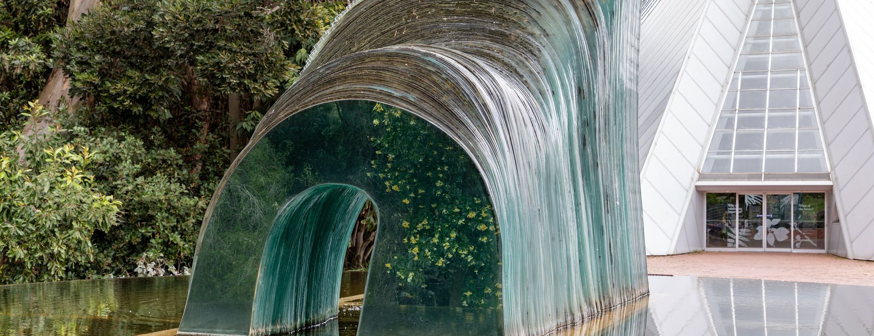 A glass sculpture and the Bicentennial Conservatory in the Adelaide Botanic Garden